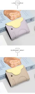Close-up of cute elephant-shaped leather card holder with light purple and grey colors
