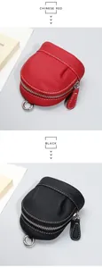 Detail of red and black lychee grain leather coin purses with silver metal zipper and carabiner