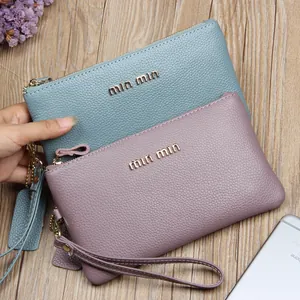 Slim genuine leather wristlet clutch with litchi grain texture and gold metal logo
