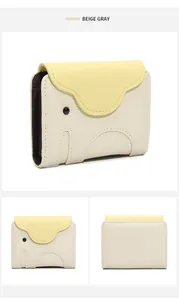 Detail of cute elephant card holder with beige gray pebble leather and multiple slots