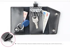 Macro view of multi-slot black lychee leather key case with metal hooks and card slots