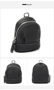 Mini backpack style coin purse in black lychee grain leather with white stitching