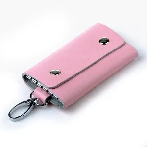 Pink lychee grain leather key pouch with double snap closure and silver lobster clasp