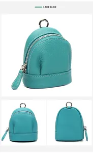 Macro detail of lake blue lychee texture leather mini coin pouch with silver zipper