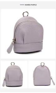 Detail of mambo purple mini leather coin purse with lychee grain texture and silver ring