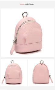 Detail of mini backpack coin purse in light pink lychee grain leather with silver zipper