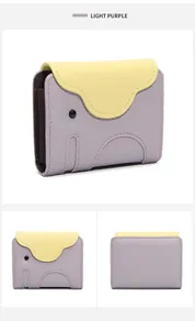 Detail of light purple elephant card holder with yellow flap in pebbled leather