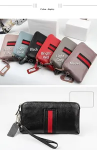 Detail view of genuine leather zip-around wallets in multiple colors with stripe accent
