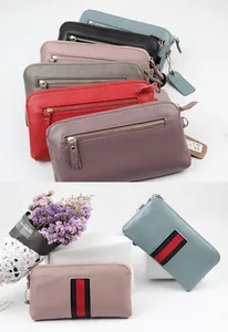 Detailed view of genuine leather women long wallets with pebbled texture and zip closure