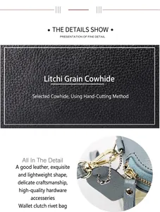 Detail of black lychee grain leather texture and light gold metal hardware on women's wallet