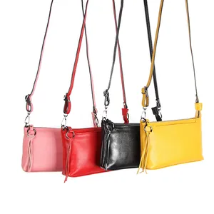 Women's genuine leather crossbody bag with side tassel detail in four pastel colors