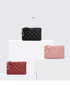 Detailed shot of sheepskin quilted key pouches with golden hardware in three colors
