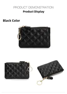 Detail view of black quilted sheepskin key case showing metal ring and smooth zipper