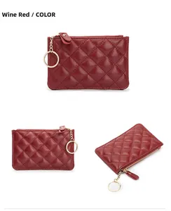 Detail of wine red quilted sheepskin coin purse with gold zipper and keychain attachment