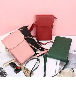 Mini leather crossbody phone bags in pink, black, red, and green with adjustable straps