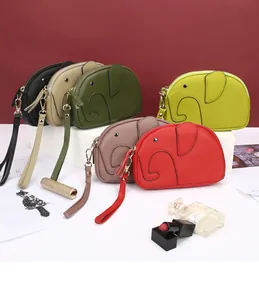 Mini elephant-shaped genuine leather wristlet purses in six colors on white display stands