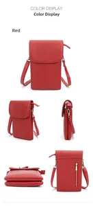 Detail view of red pebbled leather small crossbody phone bag with adjustable strap