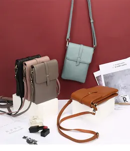 Detailed macro of multi-color leather phone bags showing lychee texture and flap belts