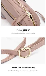 Detail der rosa Lederhandtasche mit goldenen Reißverschlüssen und abnehmbarem Schultergurt