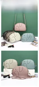 Detailaufnahme von tierförmigen Elefanten-Ledertaschen in verschiedenen modischen Farben