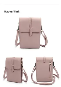Detailed view of dusty pink leather crossbody bag with lychee texture and rear zip pocket