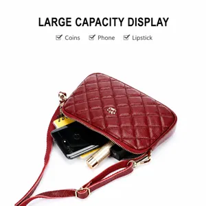 Red quilted leather crossbody bag showing large capacity for phone and cosmetics