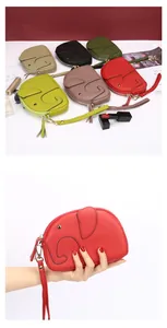 Close-up of elephant-shaped leather coin purses in various colors with wrist straps
