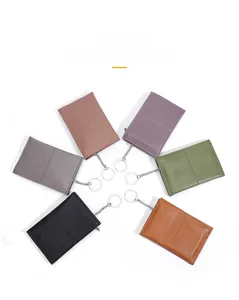 Cowhide leather coin purse detail featuring six colors and pebbled texture with keychain