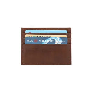Slim crazy horse leather card holder with three card slots in a brown vintage finish