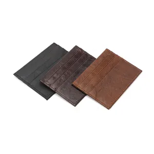 Slim crazy horse leather card holder in black and brown finishes with three card slots