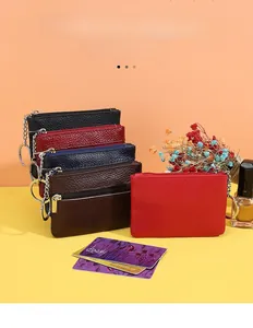 Detailed top-grain leather coin purses in various colors with metal keychain and zippers