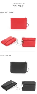 Detail view of red and black lychee grain genuine leather coin purses with key rings