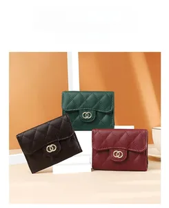 Quilted leather wallets in dark green, coffee and burgundy with gold buckles
