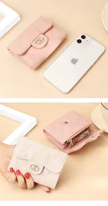 Detail showing pink and off-white quilted leather wallets with gold ring buckles and snap closures