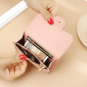 Pink quilted genuine leather short wallet for women featuring multiple card slots and coin pocket