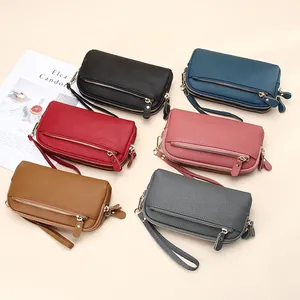 Genuine cowhide leather wristlet clutch with three-tier zipper and gold hardware