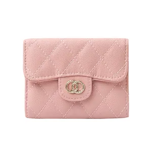 Pink quilted leather wallet for women with gold ring clasp and litchi grain texture