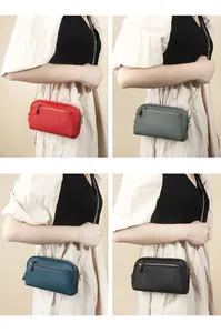 Detail showing genuine leather phone bags in four colors with gold metal chain straps