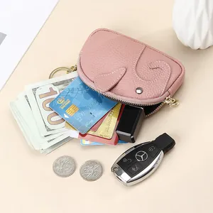 Pink elephant leather coin purse with keychain showing storage for cards and keys