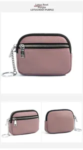 Detail view of lotus root purple genuine leather coin purse with silver double zippers