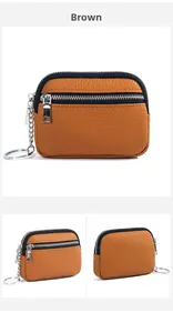 Close-up of tawny genuine leather coin purse with double zippers and silver keychain