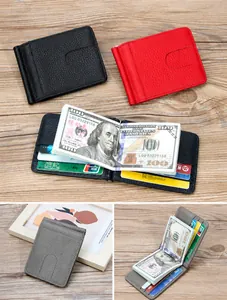 Close-up of pebble grain leather wallet featuring a durable metal money clip and card slots
