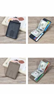 Detail of slim leather money clip wallet in dark blue and khaki with steel clip