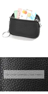 Detail of top layer cowhide litchi texture coin purse with double silver zippers