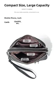 Vista macro della borsa in pelle nera con scomparti multipli a cerniera e tasche interne