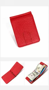 Macro detail of red litchi grain leather wallet featuring metal money clip and card slots