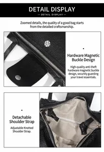 Detail of black pebbled leather crossbody bag with magnetic clasp and fabric lining