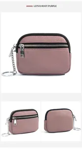 Macro detail of lotus root purple pebbled leather coin purse with silver double zippers