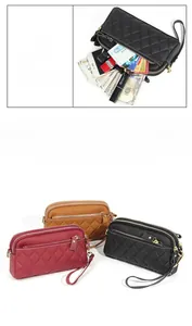 Detailed view of the quilted leather wallet showing spacious phone and card compartments