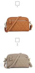 Close-up of quilted leather crossbody bags in earthy yellow and light gray with gold zippers